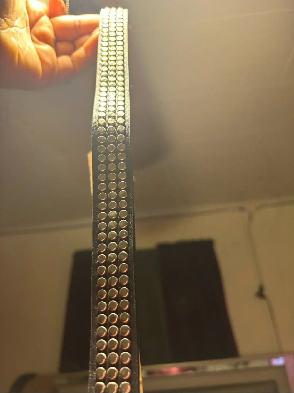 Black Studded Envelope Clutch comes with a detachable strap